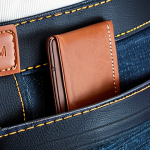 **Image Prompt:** A minimalist, slim leather wallet (TUMI Alpha Slim) discreetly peeking out of a stylish jean pocket. Focus on the wallet's thin profile and the elegance of the leather.